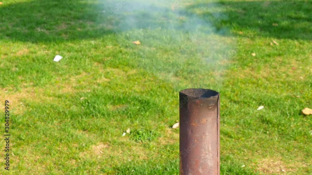 Smoke from a black pipe. Smoke comes out of the grill pipe. Smoke from a black pipe. Smoke comes out of the grill pipe.