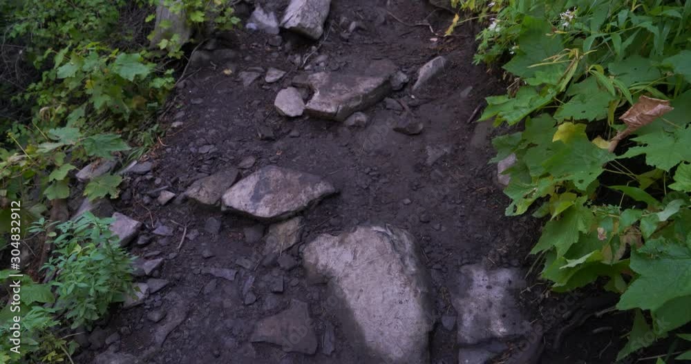 Close up of rocky path to mount Timpanogos panning upward toward trail ahead Close up of rocky path to mount Timpanogos panning upward toward trail ahead