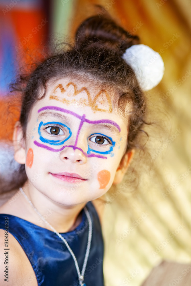Portrait of baby girl with painted face