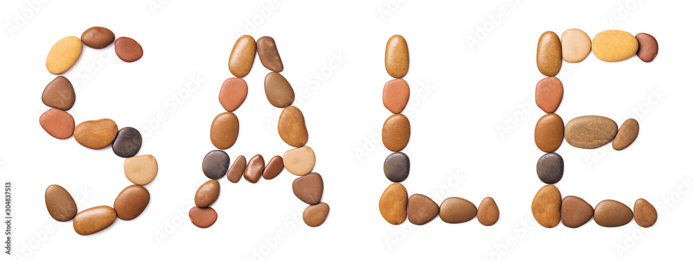 Word of sale laid out of stones, isolated on a white background. Seasonal Sale Word of sale laid out of stones, isolated on a white background. Seasonal Sale