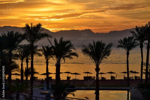 Sunset and palm trees in Taba  Egypt.