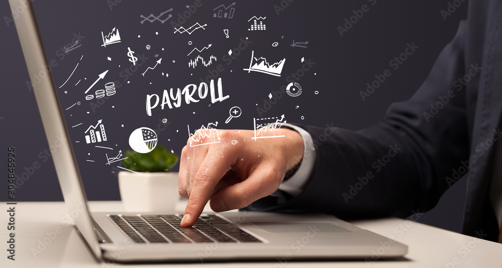 Businessman working on laptop with PAYROLL inscription, modern business concept Businessman working on laptop with PAYROLL inscription, modern business concept