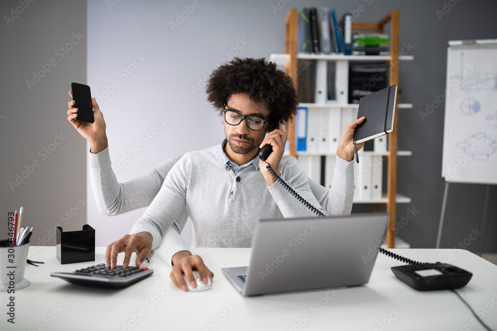 Multitasking Businessman In Office Stock Photo | Adobe Stock