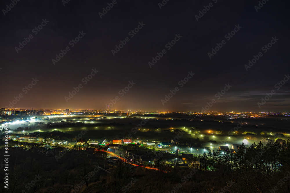 City lights in the fog