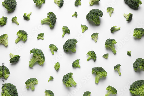 Fresh tasty broccoli on white background, top view