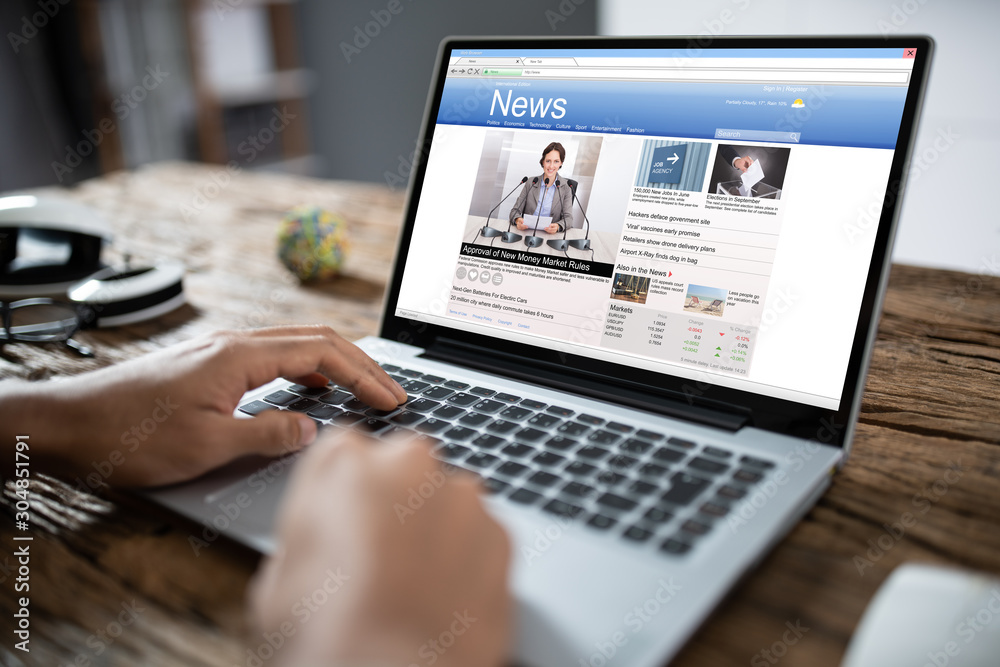 Businessman Reading News On Laptop Businessman Reading News On Laptop