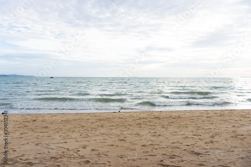 Beautiful dawn, morning sun rises by the sea. Scenic beach, coastline, rocks, cloudscape and skyline photography. Sunrise during the early hours of a summer morning by the beach. Sunset by the beach.