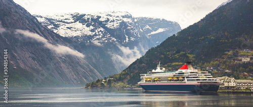 Norwegian fjord with cruise ship photo