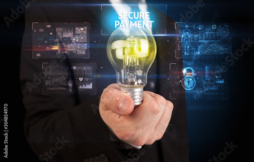 Businessman holding lightbulb with SECURE PAYMENT inscription, online security idea concept