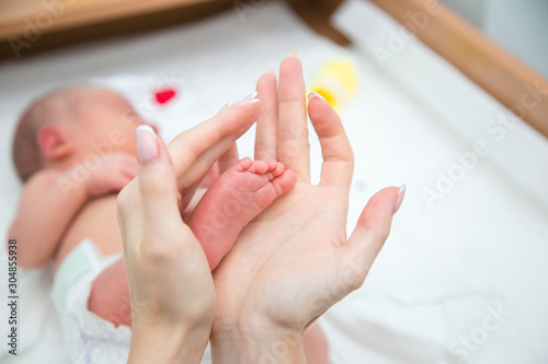 baby feet in mothers hands