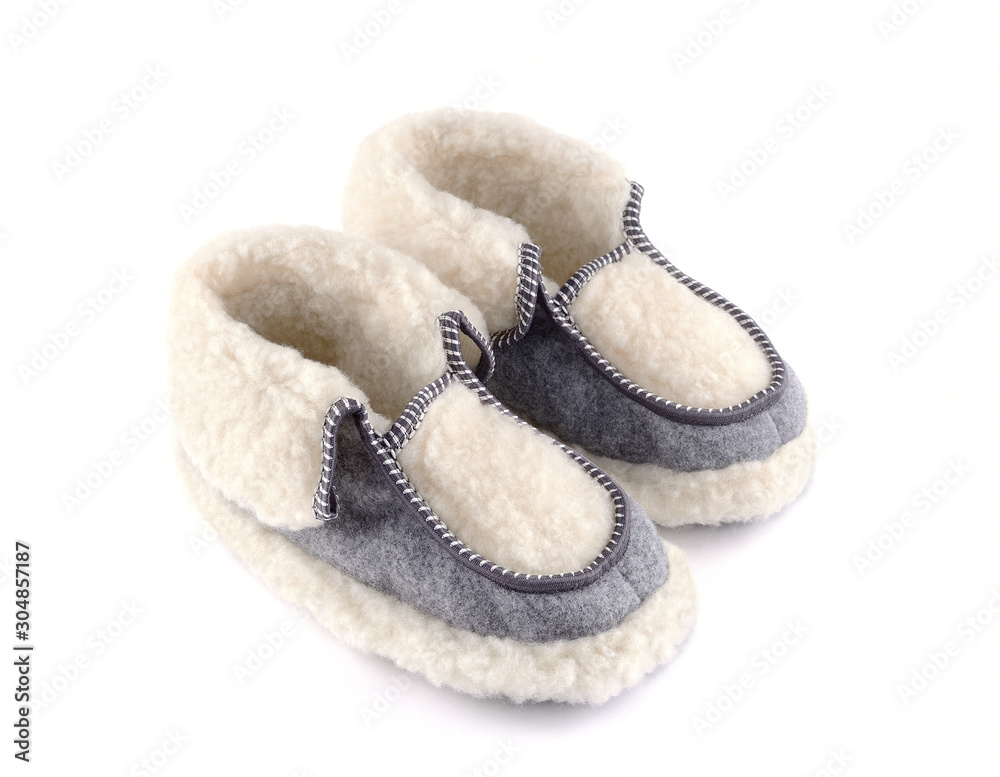 Blue wool house slippers isolated on white background Blue wool house slippers isolated on white background