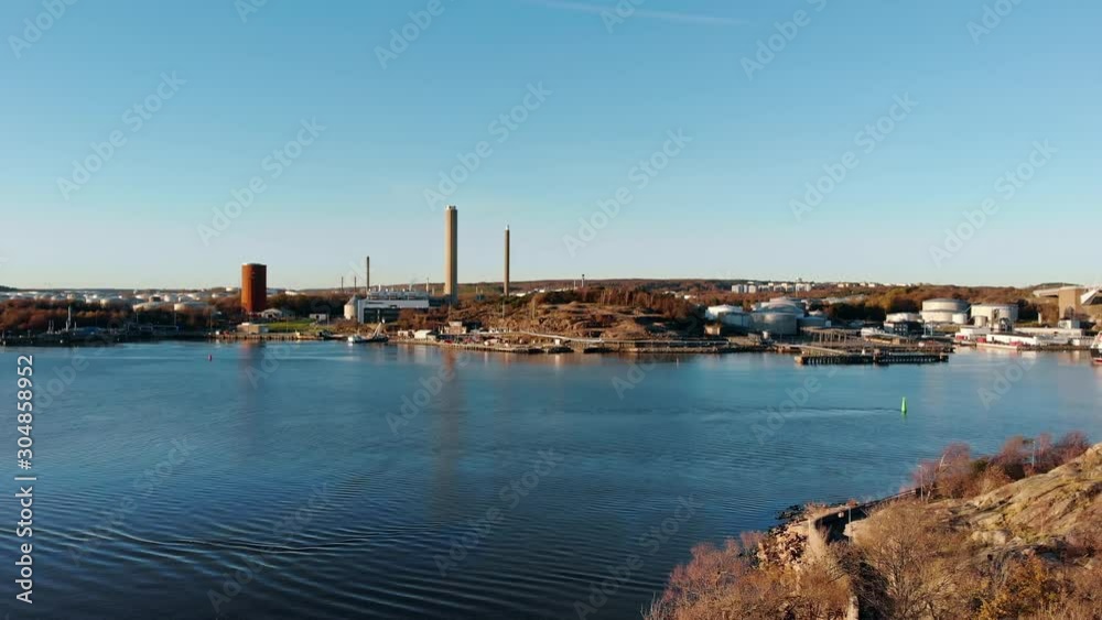 Aerial dolly 4k drone view towards thermal power station, Gothenburg harbour, Sweden. Aerial dolly 4k drone view towards thermal power station, Gothenburg harbour, Sweden.