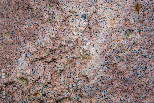 Texture details of prick granite rock in Poland