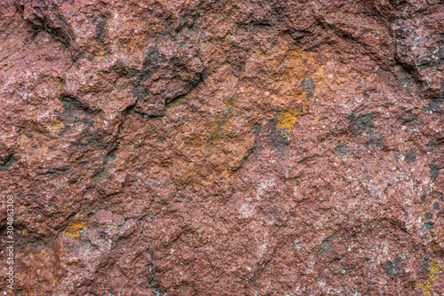 Details of texture of Baltic red porphyry rock in Poland