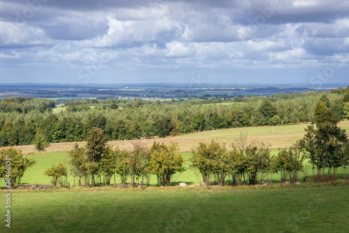 Rural landscape seen from viewing tower on the top of Dylewska Mountain in Landscape Park of Dylewo Hills in Poland photo