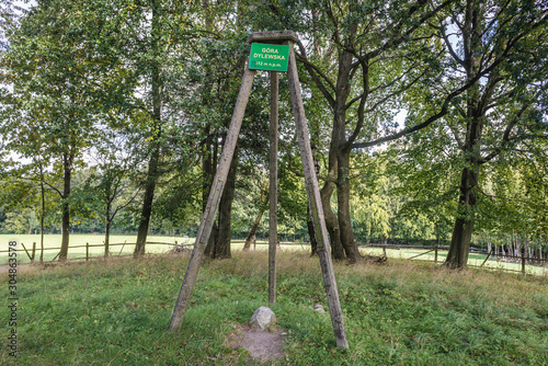 Sign on the top of Dylewska Mountain in Landscape Park of Dylewo Hills in Poland photo