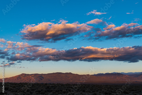 Colorful sunset and clouds mountains and high desert landscape near Taos, New Mexico