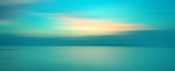 Keuken achterwand Turquoise Motion blurred background of sunset on the sea  © opasstudio