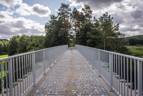 Fototapeta Naklejka Na Ścianę i Meble -  Antique railroad bridge in Glaznoty, small village in Masuria region of Poland