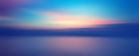 Fototapete Sonnenuntergang Bewegungsunschärfe Hintergrund des Sonnenuntergangs auf dem Meer  © opasstudio