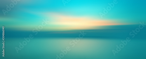Motion blurred background of sunset on the sea