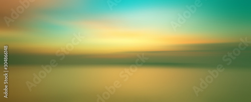 Motion blurred background of sunset on the sea
