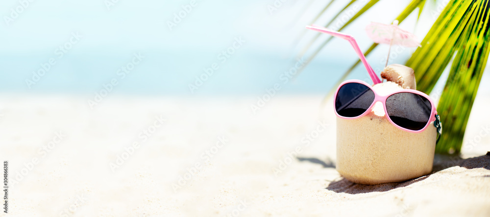 summer tropical beach background with fresh  juice coctail in hot summer day