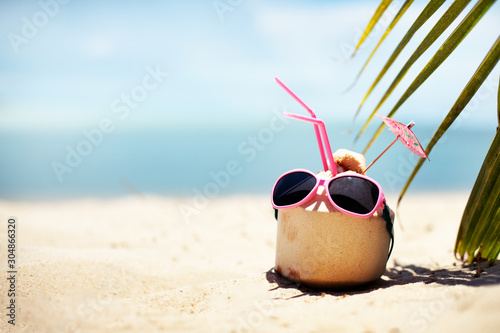 summer tropical beach background with fresh coconut in hot summer day