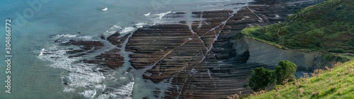 Zumaia flysch geological strata layers ultrawide panoramic view, Basque Country photo