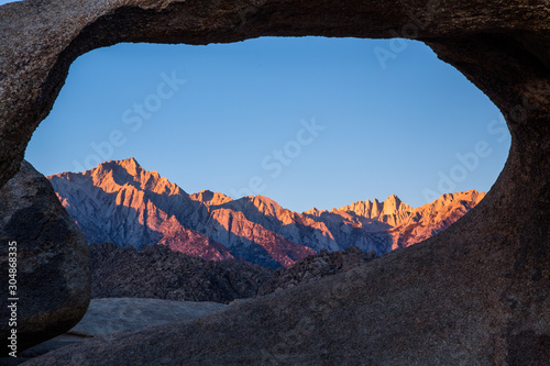 Alpenglow sunrise on the Range of Light Eastern Sierra Mountains and Mt Whitney. photo