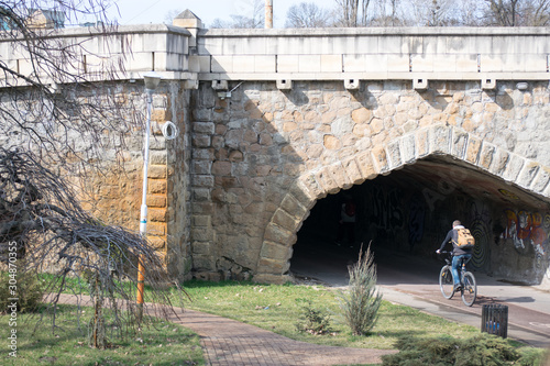 cyclist passes under the Traian bridge in Timisoara photo