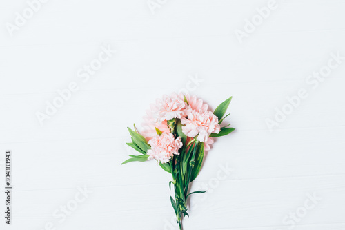 Small bouquet of beautiful pale pink carnations flowers
