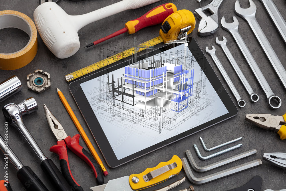 Fototapeta premium Tablet with construction tools and 3d house plan concept