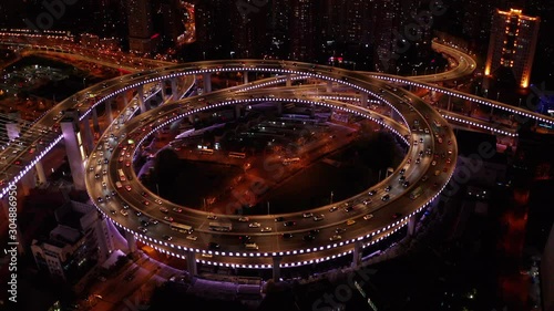 Aerial drone 4k video scene of traffic on Nanpu Spiral road at night, Nanpu bridge, Huangpu River,  Shanghai, China