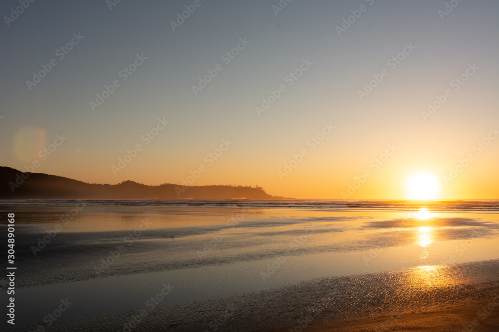 sandy beach sunset in tofino bc
