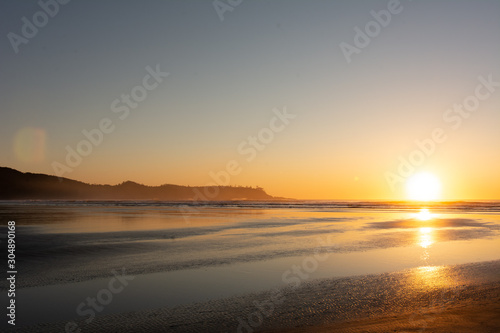 sandy beach sunset in tofino bc