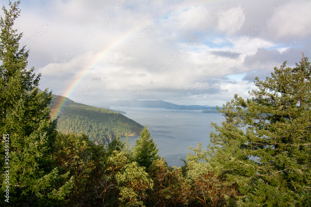 a rainbow over the ocean of the saanich inlet