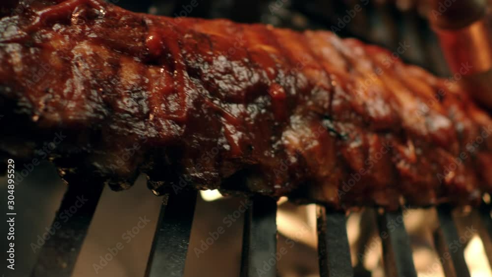 Ribs on flaming grill barbecued