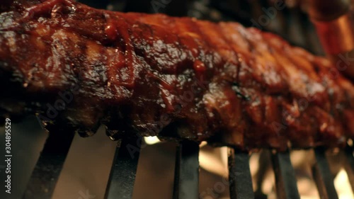 Ribs on flaming grill barbecued photo