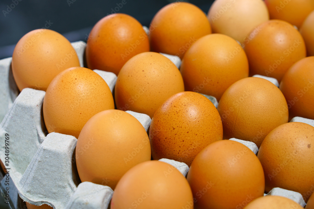 Cartons of fresh free-range brown organic eggs