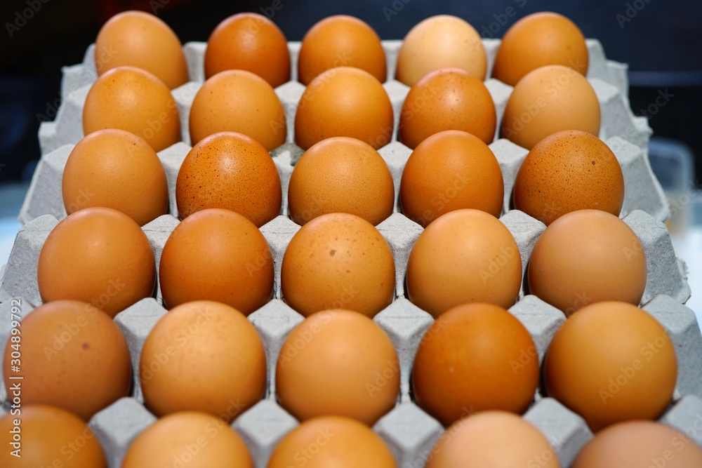 Cartons of fresh free-range brown organic eggs Cartons of fresh free-range brown organic eggs