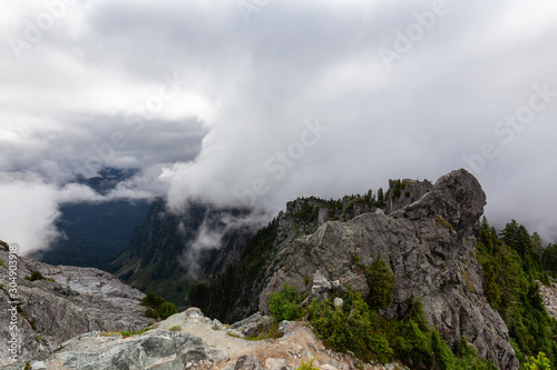 Beautiful View of Canadian Mountain Landscape during a cloudy summer morning. Taken on Crown Mountain, North Vancouver, British Columbia, Canada.