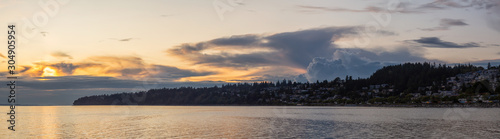 White Rock, British Columbia, Canada. Beautiful Panoramic View of Residential Homes on the Ocean Shore during a sunny and cloudy summer sunset. © edb3_16