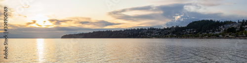 White Rock, British Columbia, Canada. Beautiful Panoramic View of Residential Homes on the Ocean Shore during a sunny and cloudy summer sunset. © edb3_16