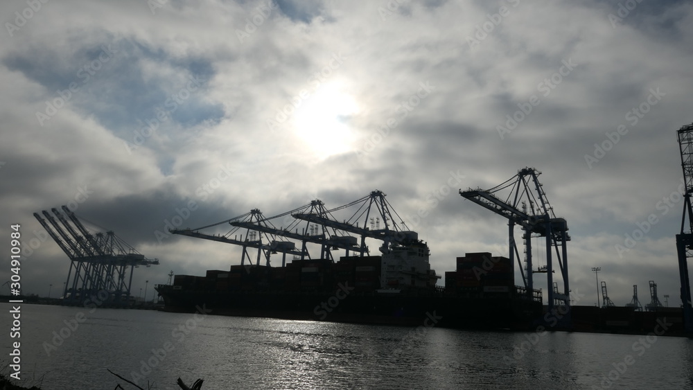 cranes in container dock harbor