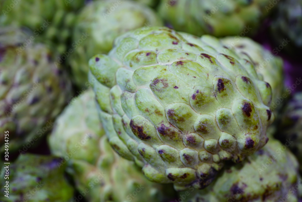 Annona fruit in bulk at a market Annona fruit in bulk at a market