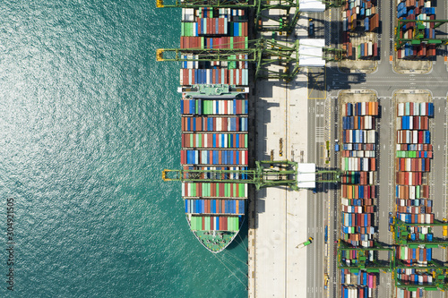 Photography Stunning aerial view of the port of Singapore with hundreds of colored containers ready to be loading on the cargo ships