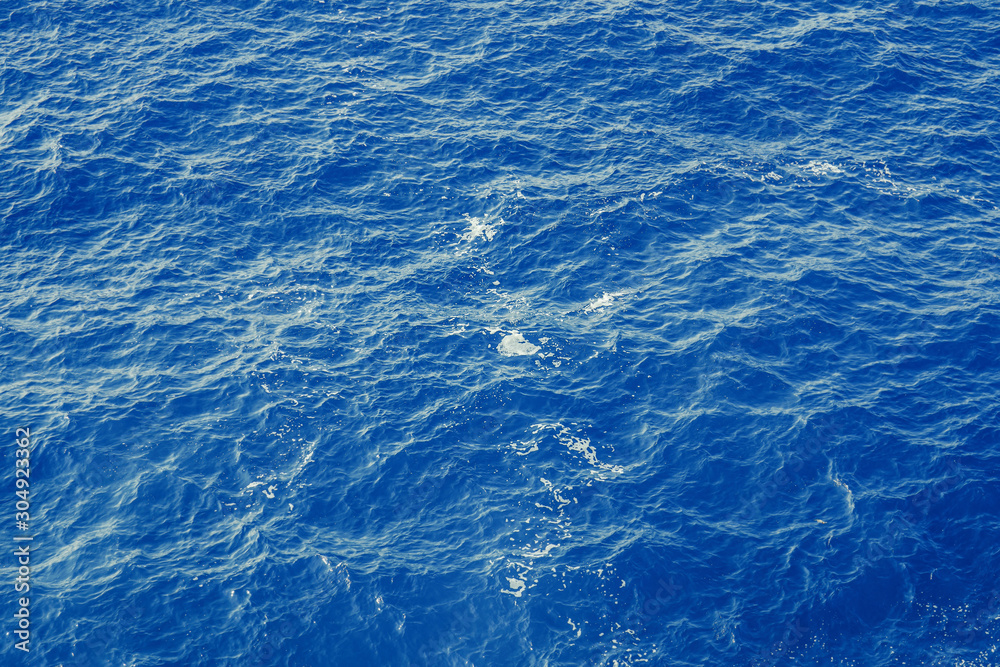 Fototapeta premium Blue sea surface with waves aerial view
