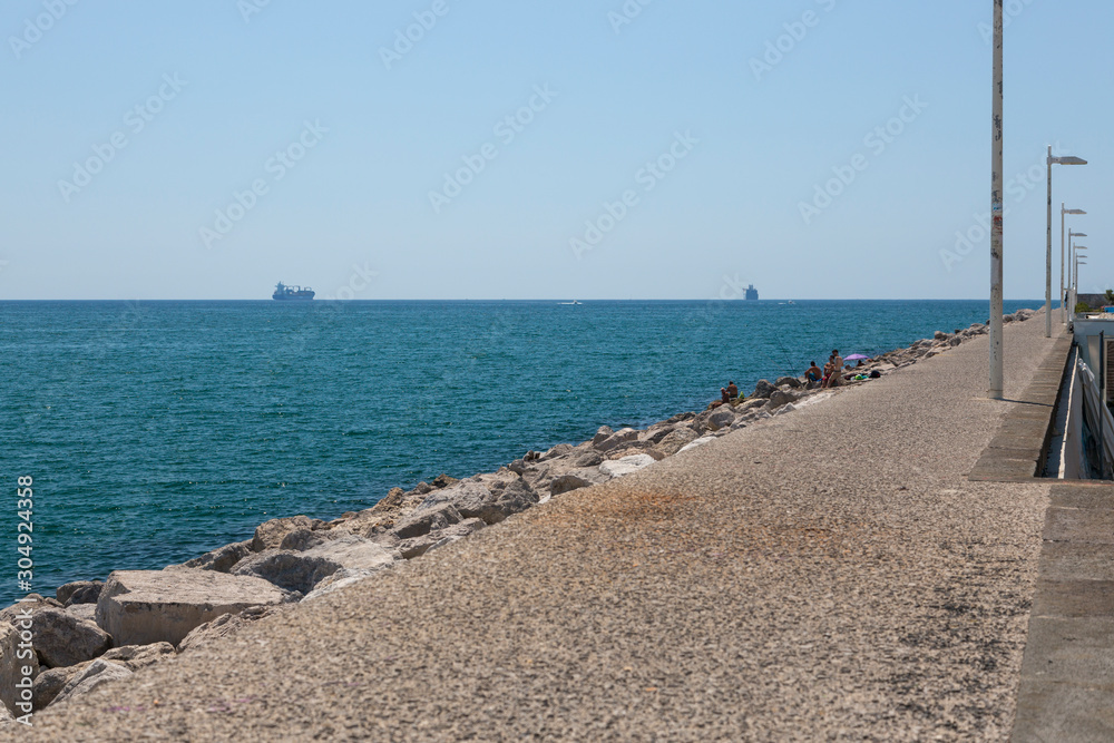 View of the Tyrrhenian Sea from the breakwater in the port of Salermo in Italy View of the Tyrrhenian Sea from the breakwater in the port of Salermo in Italy