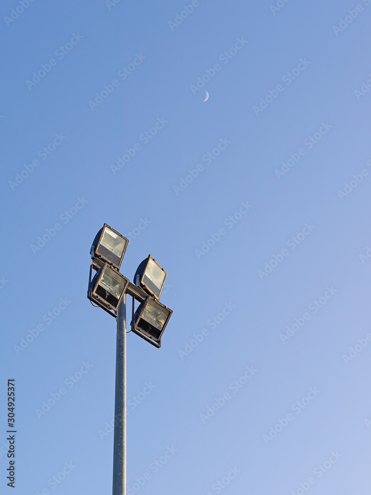 Spotlight for outdoor square shape 4 piece made with steel stick on the pole steel have blue sky background. Spotlight for outdoor square shape 4 piece made with steel stick on the pole steel have blue sky background.